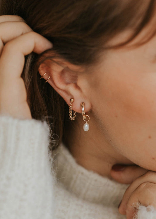 pearl hoops with mini annex earrings styled on a model