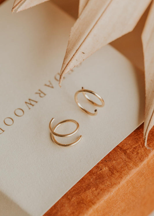 Close-up of tiny twist earrings Hello Adorn