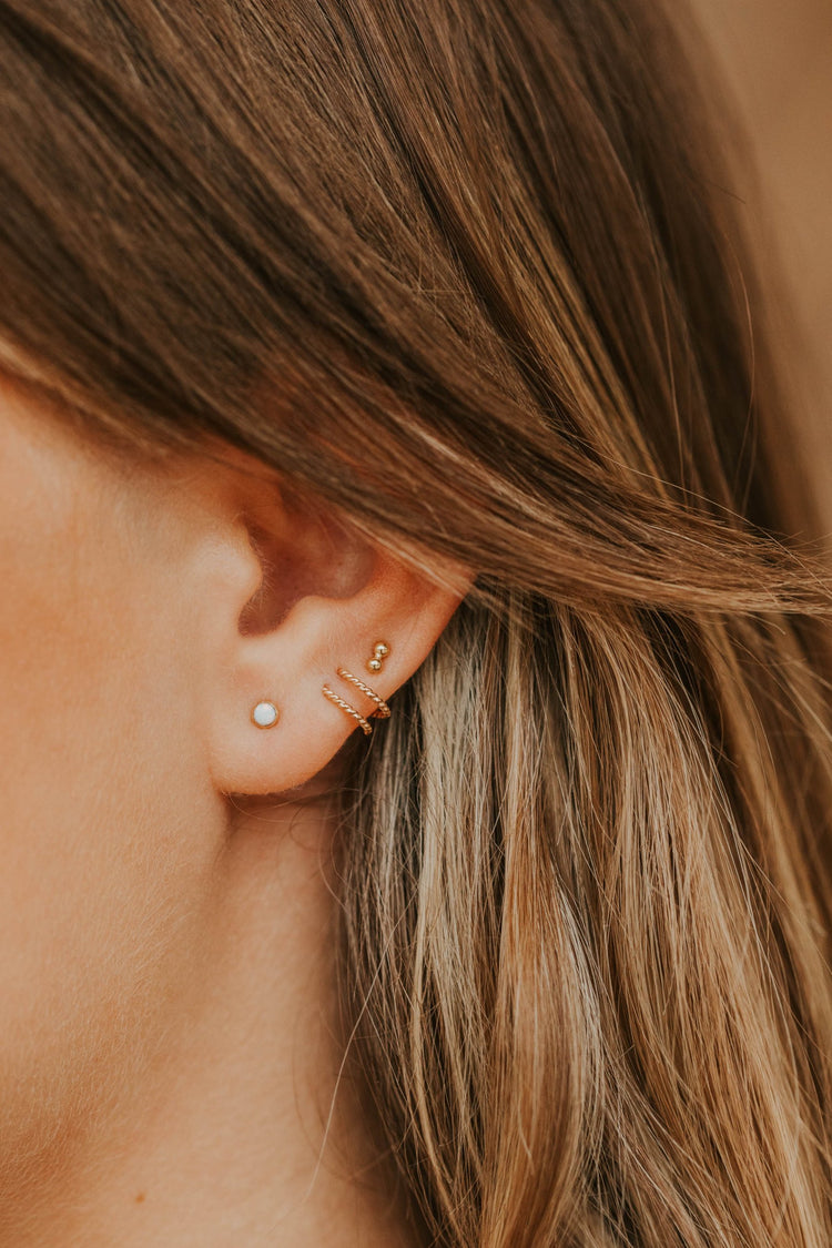 14k gold fill tiny twist earrings styled with opal stud and double dot stud by Hello Adorn