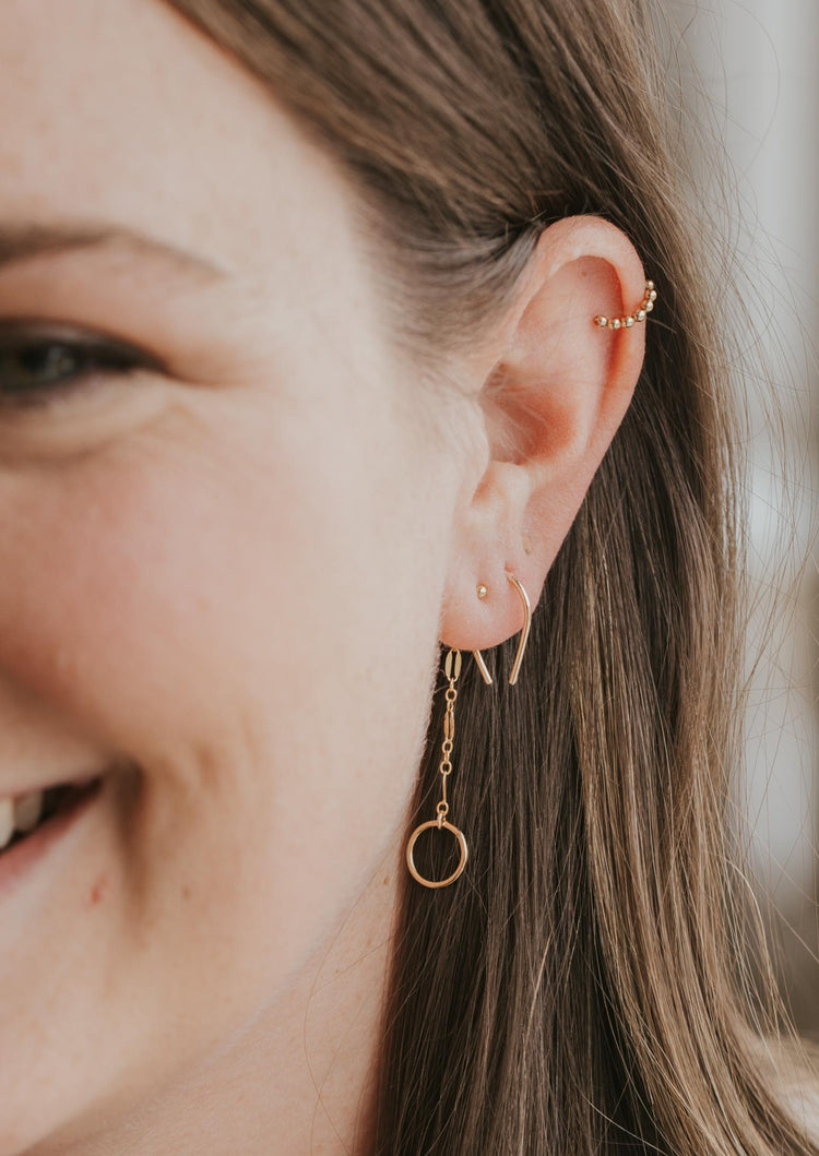 14k gold fill tiny horseshoe threader earrings styled with beaded gold ear cuff and backdrop earring by Hello Adorn