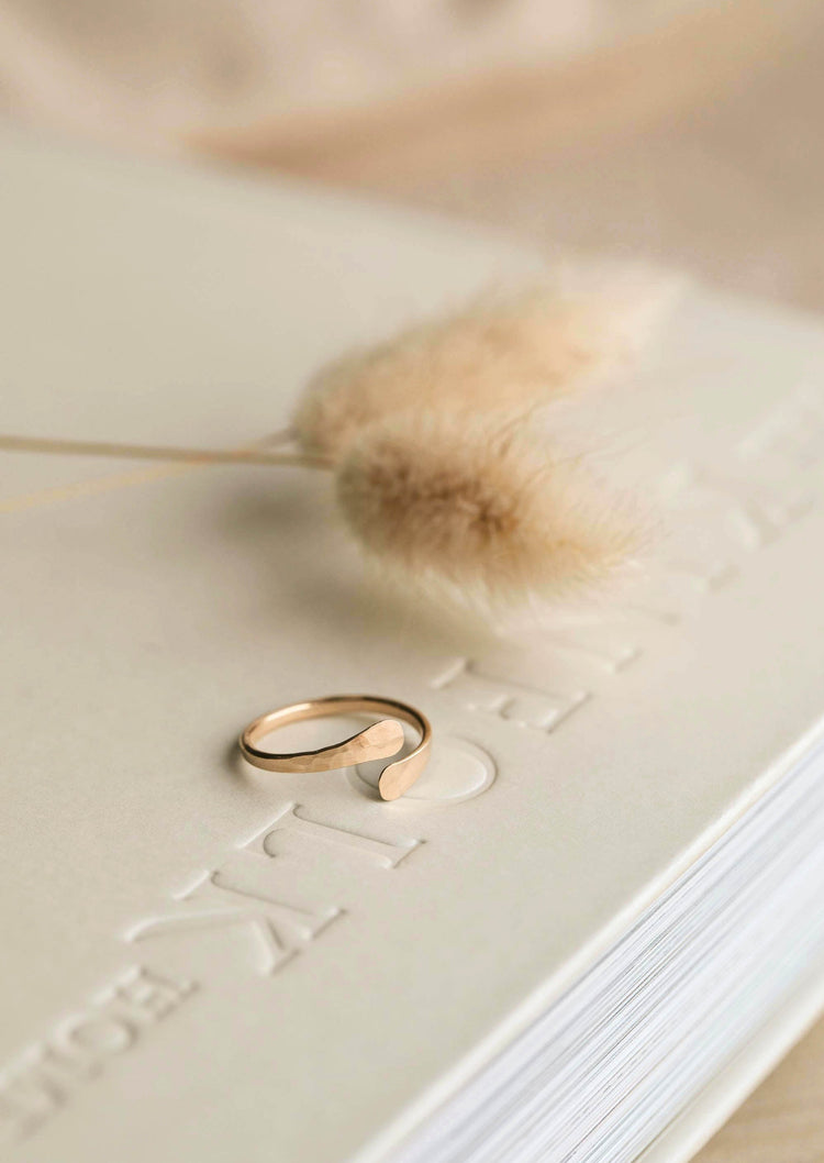 A hammered open ring named Sonder Ring in 14k gold fill handmade for everyday jewelry wear, can be used as a statement ring to create a ring stack by Hello Adorn.