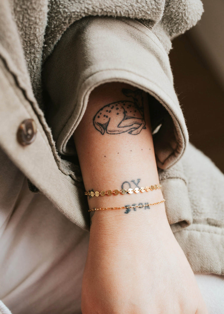 A beautiful 14kt Gold Fill bracelet stack featuring a round disc confetti style bracelet.