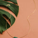 A stone necklace from the Gemma Collection from Hello Adorn, this green stone necklace is handmade from a green gemstone and a dainty gold chain necklace to create this statement necklace.