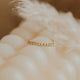 A gold chain ring created by Hello Adorn, a versatile ring to use as a staking ring or statement ring.
