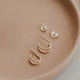 Double twist earrings by Hello Adorn in double up post style shown in 14k gold fill.
