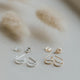 Fake double piercing earrings shown in sterling silver and 14k gold fill by Hello Adorn in double up post style.