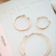 Thin hoop earrings in Cypress Hoops by Hello Adorn, shown in three sizes of Hoops from smallest hoop earrings to largest hoop earrings for daily wear earrings.