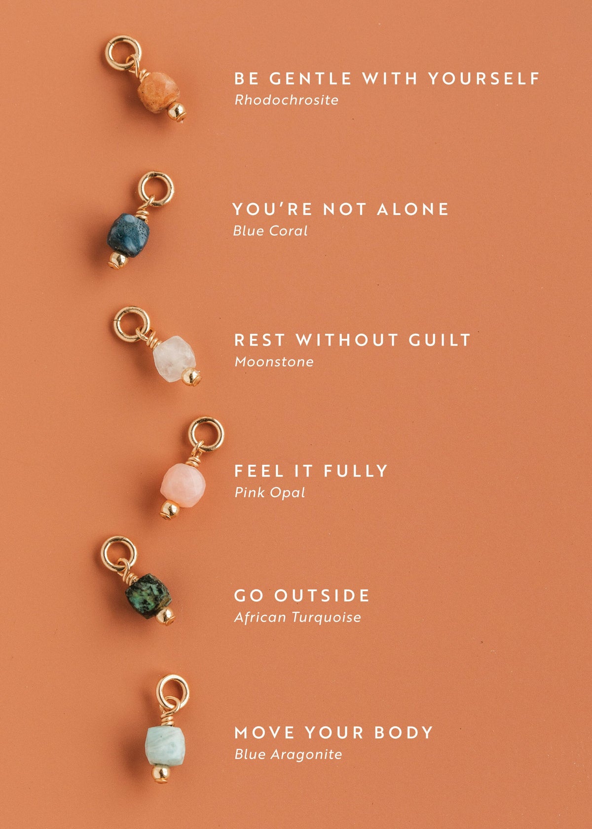 Set of Hello Adorn gemstone charms on a peach background with motivational mental health necklace phrases.