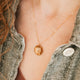 Gold Hello Adorn Mental Health necklace with circular pendant