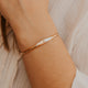 14K Gold Fill Signet Cuff by Hello Adorn - single cuff with letter C engraved on tapered center panel on prop
