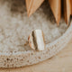 A gold hammered ring created by Hello Adorn in supermoon style to look like a moon ring, a great statement ring to add to your ring stack.