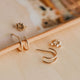 Spiral hoop twist double earrings shown in 14k gold fill by Hello Adorn.