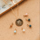 Gold Hello Adorn Mental Health necklace with circular pendants and meaning charms