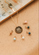 Gold Hello Adorn Mental Health necklace with circular pendants and meaning charms