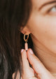 light pink stone on earrings with hoops