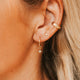 14K Gold Fill Grace Charms by Hello Adorn - CZ charm huggie worn in model's ear with layered ear stack