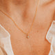 14K Gold Fill Grace Necklace by Hello Adorn - tiny CZ star pendant on delicate chain worn on model's chest
