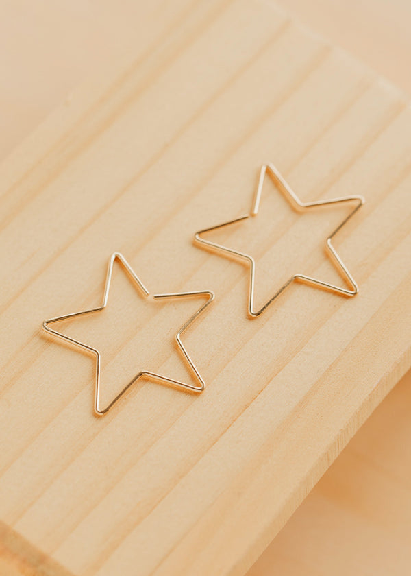 Hello Adorn Star Threader Earrings in 14kt Gold Fill shown flat with a polished background.