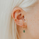 14k gold fill Tiny Wave Ear Climber earring in second lobe piercing styled with green gemstone drop hoop and ear cuff by Hello Adorn