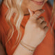 Wondering if you can mix gold and silver jewelry, the answer is YES! Hello adorn provides jewelry ideas for gold and silver jewelry together. this look features a ring stack which includes a cleo wire wrapped ring, two thin rings, a gemstone ring, and a beaded ring paired with a bracelet idea to create a bracelet stack with thick chain bracelets, a gold simple bracelet, and a simple silver chain.