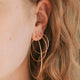 Three sizes of Cypress Hoops shown from largest hoop earrings to smallest hoop earrings created by Hello Adorn for simple gold earrings for daily use.