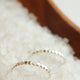 Silver stacking rings with hammered ring look in tiny dot confetti band style by Hello Adorn.