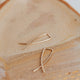 Gold threader earrings by Hello Adorn in MINI Pescado style shown in 14k gold fill.