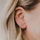 Hello Adorn twist hoop earrings on ear