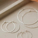 Silver hoop earrings created by Hello Adorn as thin hoop earrings for daily wear earrings in Cypress Hoops style.
