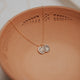 A custom necklace with symbols stamped on jewelry handmade by Hello Adorn, a staple necklace to add to any necklace layering or wear as a statement necklace.