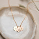 Gold initial necklace with three hand stamped jewelry pendants by Hello Adorn.