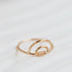 A 14k gold fill wire wrapped ring in a double rainbow shape, a statement ring for any ring stack created by Hello Adorn.