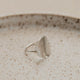 A silver statement ring created to look like a moon ring, this ring started as a circle ring and then was hammered to create this beautiful textured ring by Hello Adorn.