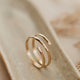 A wire wrapped ring created by Hello Adorn to make a wrap ring look like 2 rings together using thicker wire, a great statement ring to add to any ring stack.